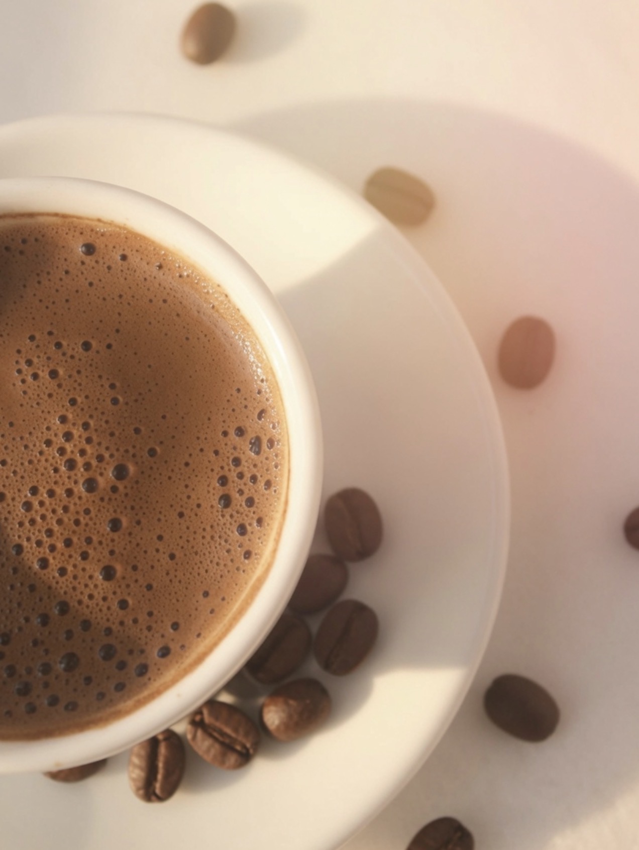 A cup of coffee next to a tense, tired-looking person